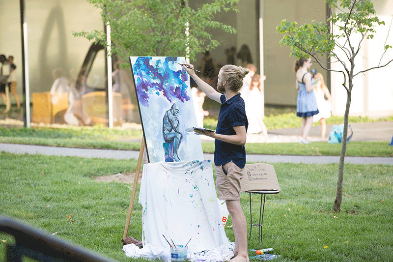 Man painting outdoors