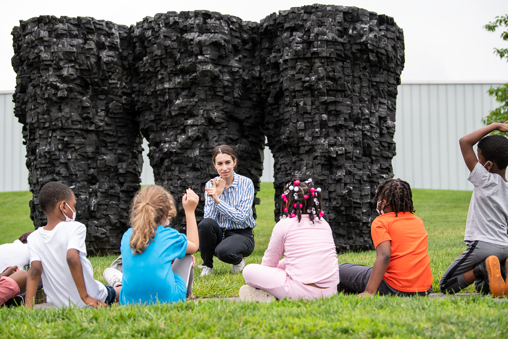 Kids in Donald J. Hall Sculpture Park touring
